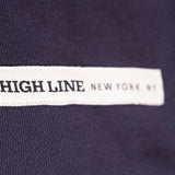 Park in the Sky Crewneck in navy. Close up of chest ribbon detail with the High Line wordmark and "New York NY"