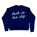 The Park in the Sky embroidered crewneck sweatshirt in navy—a navy blue crewneck sweatshirt shown from the back, featuring the phrase 'Park in the sky' embroidered in white cursive script across the upper back.