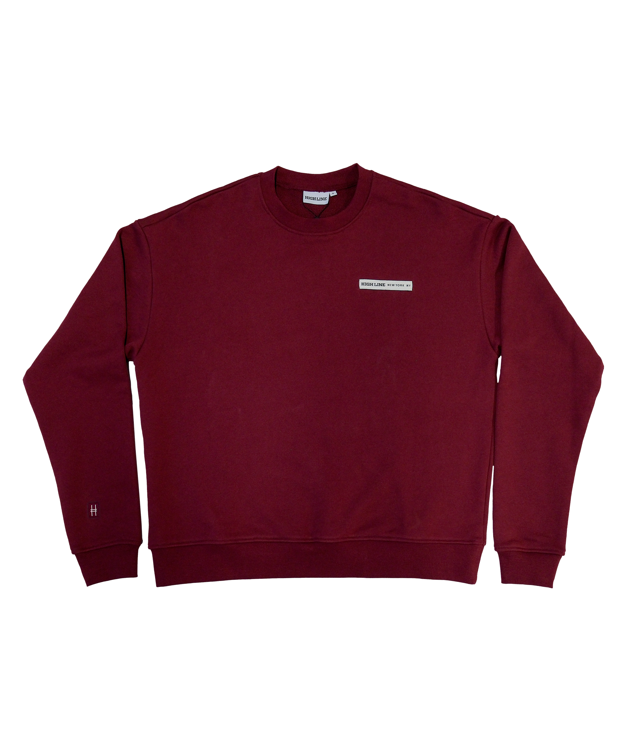 Park in the Sky Crewneck in Smokebush. Front features a chest ribbon detail with the High Line logo and "New York NY" as well as a small woven patch with the High Line railroad track-inspired "H" icon sewn on the right sleeve. Smokebush is a deep, burgundy red.