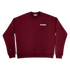 Park in the Sky Crewneck in Smokebush. Front features a chest ribbon detail with the High Line logo and "New York NY" as well as a small woven patch with the High Line railroad track-inspired "H" icon sewn on the right sleeve. Smokebush is a deep, burgundy red.
