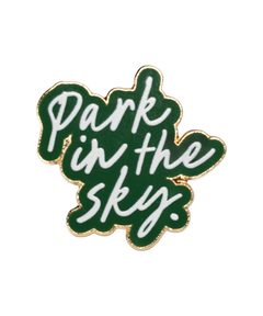 Our Park in the Sky pin sets the phrase "park in the sky" in white against green enamel.