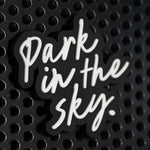Park in the Sky rubber fridge magnet on a black metal locker.