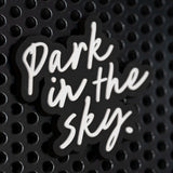 Park in the Sky rubber fridge magnet on a black metal locker.