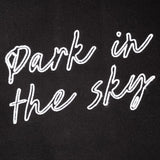 Detail shot of the "Park in the sky" embroidery on the tote.