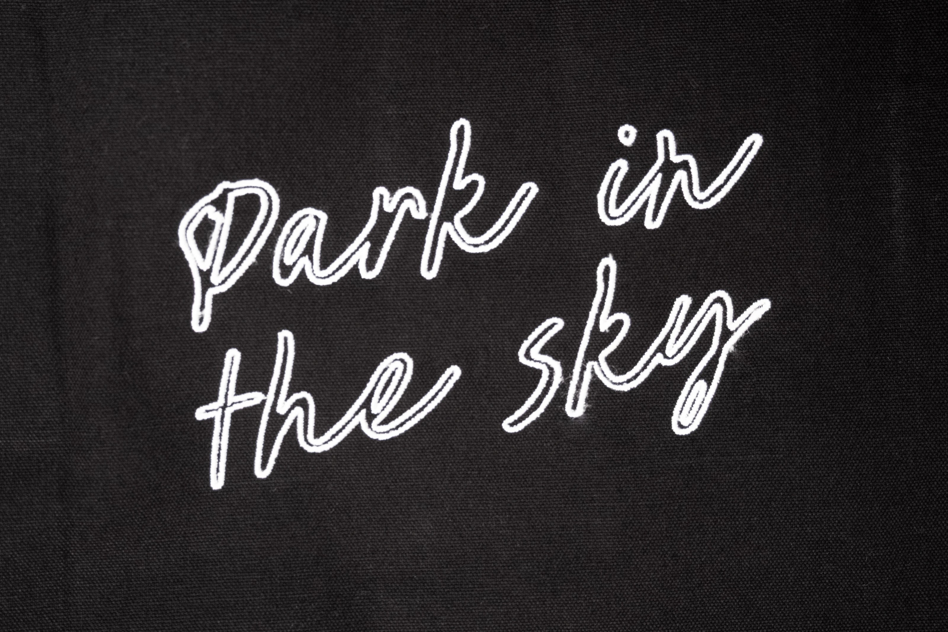 Detail shot of the "Park in the sky" embroidery on the tote.