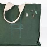 Park in the Sky Tote in Ivy featuring the High Line Icon collection enamel pins.
