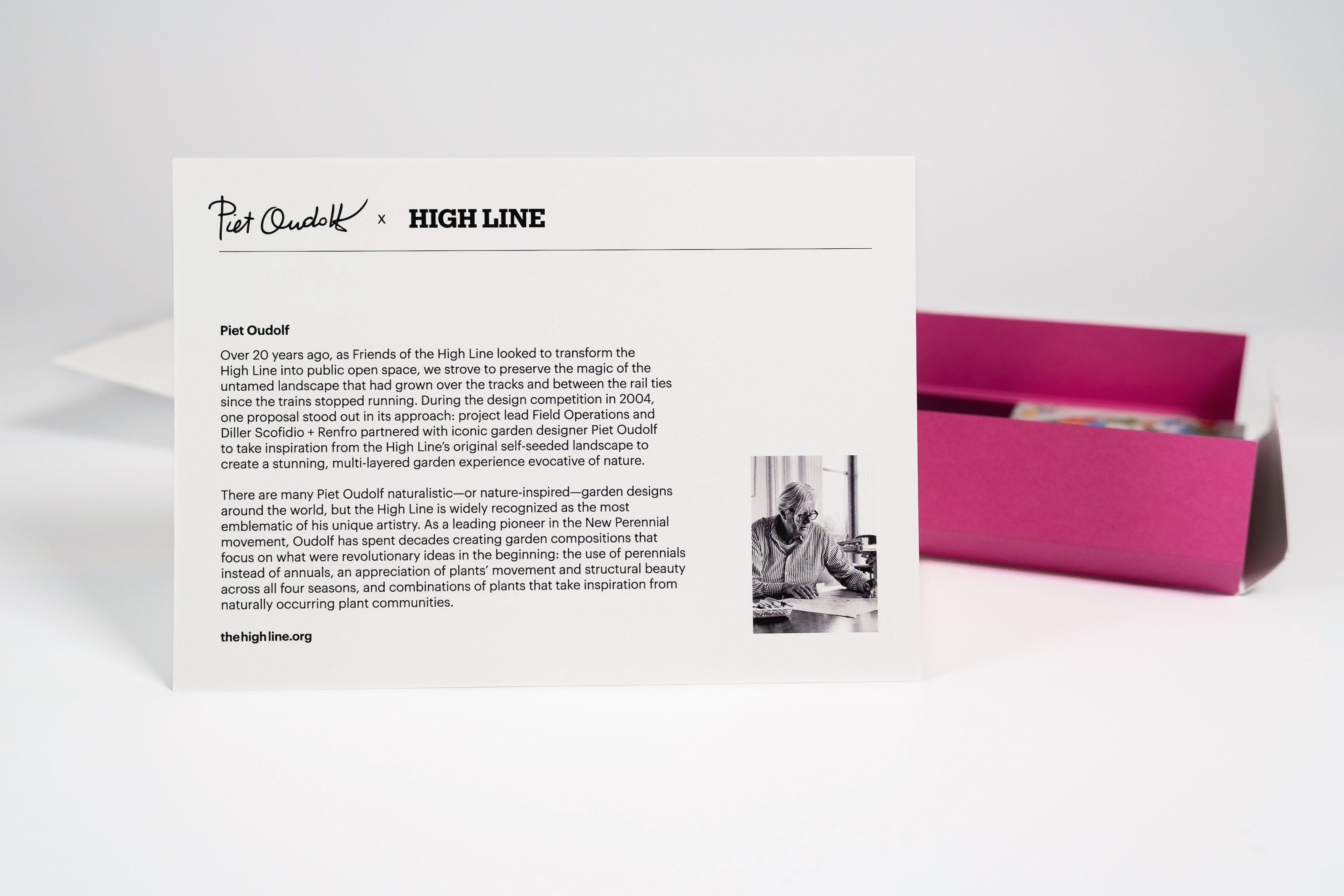 One of the Piet Oudolf Notecard Set cards—with the back, featuring a bio of Oudolf—stands in front of the open card box.