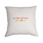 Back of Piet Oudolf Pillow Case shown on a pillow. The back features the quote "You have to know your plants" in multicolor letters.