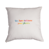 Back of Piet Oudolf Pillow Case shown on a pillow. The back features the quote "You have to know your plants" in multicolor letters.