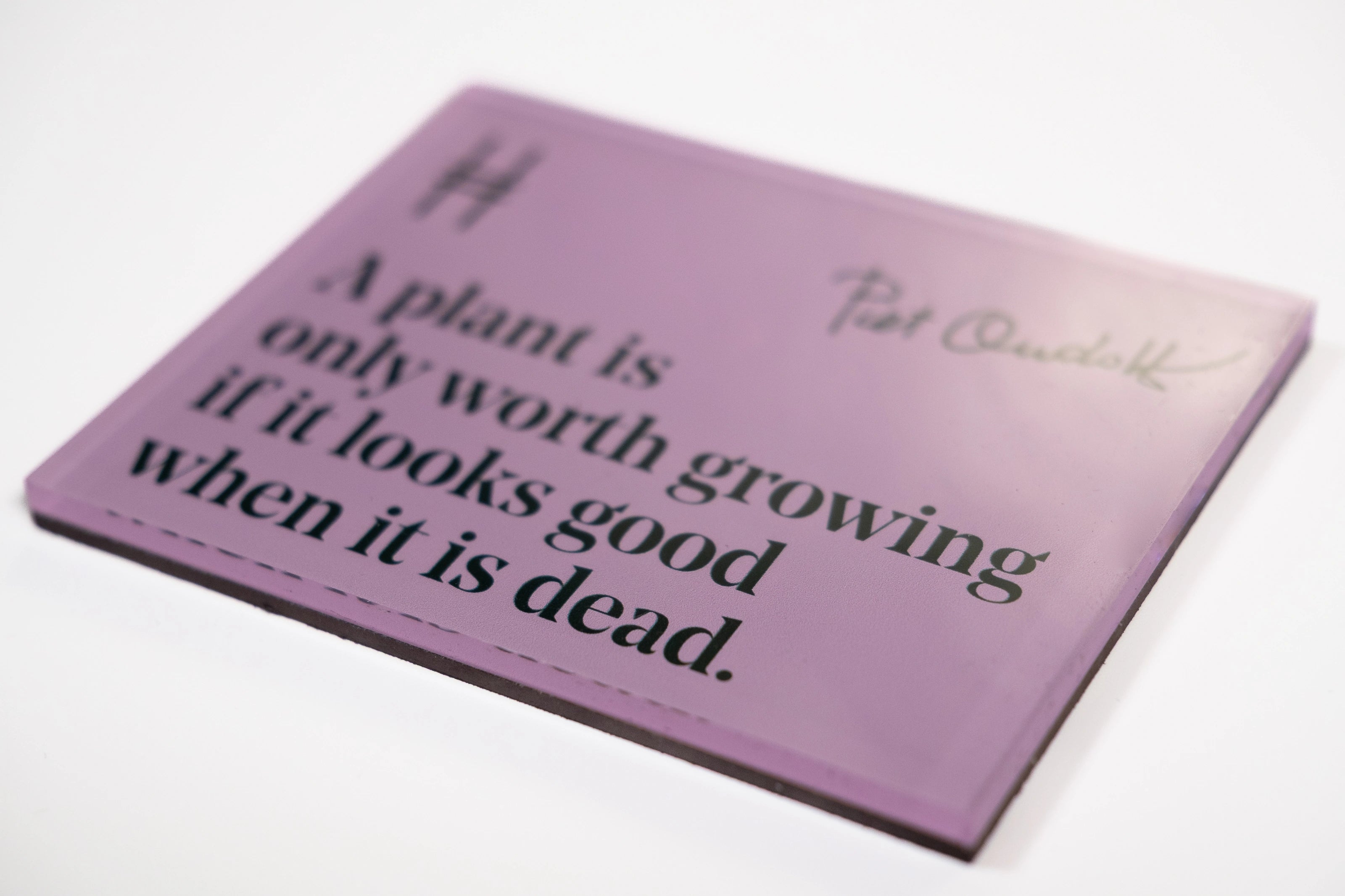Acrylic fridge magnet featuring the quote "A plant is only worth growing if it looks good when it is dead." in dark green against a pale purple, with Piet Oudolf's signature and the High Line icon.