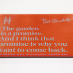 Acrylic fridge magnet featuring the quote "The garden is a promise. And I think that promise is why you want to come back." in pale blue against rich orange, with Piet Oudolf's signature and the High Line icon.