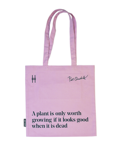 Piet Oudolf Quote Tote in Aster—a pale purple cotton canvas tote bag featuring the quote "A plant is only worth growing if it looks good when it is dead." The quote, Oudolf's signature, and the High Line icon are all in a dark Ivy green.