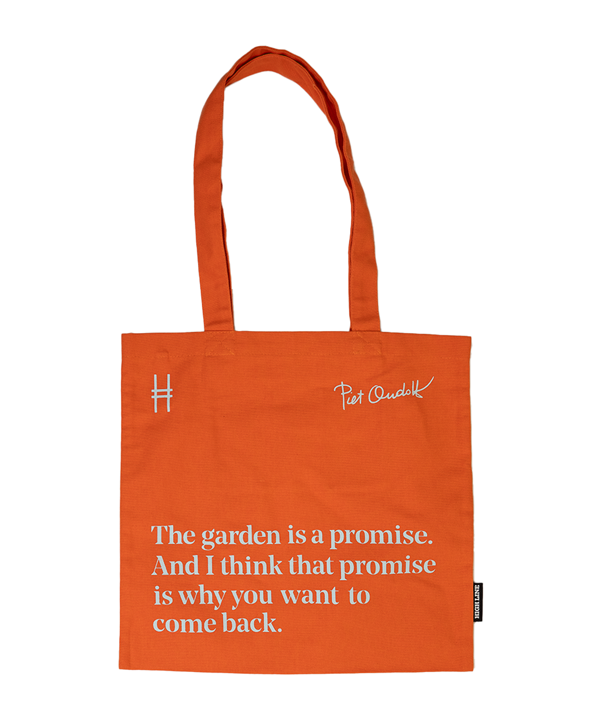 Piet Oudolf Quote Tote in Trumpet Honeysuckle—an orange cotton canvas tote bag featuring the quote "The garden is a promise. And I think that promise is why you want to come back." The quote, Oudolf's signature, and the High Line icon are all in a pale sky blue.