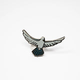 Pigeon in flight enamel pin.