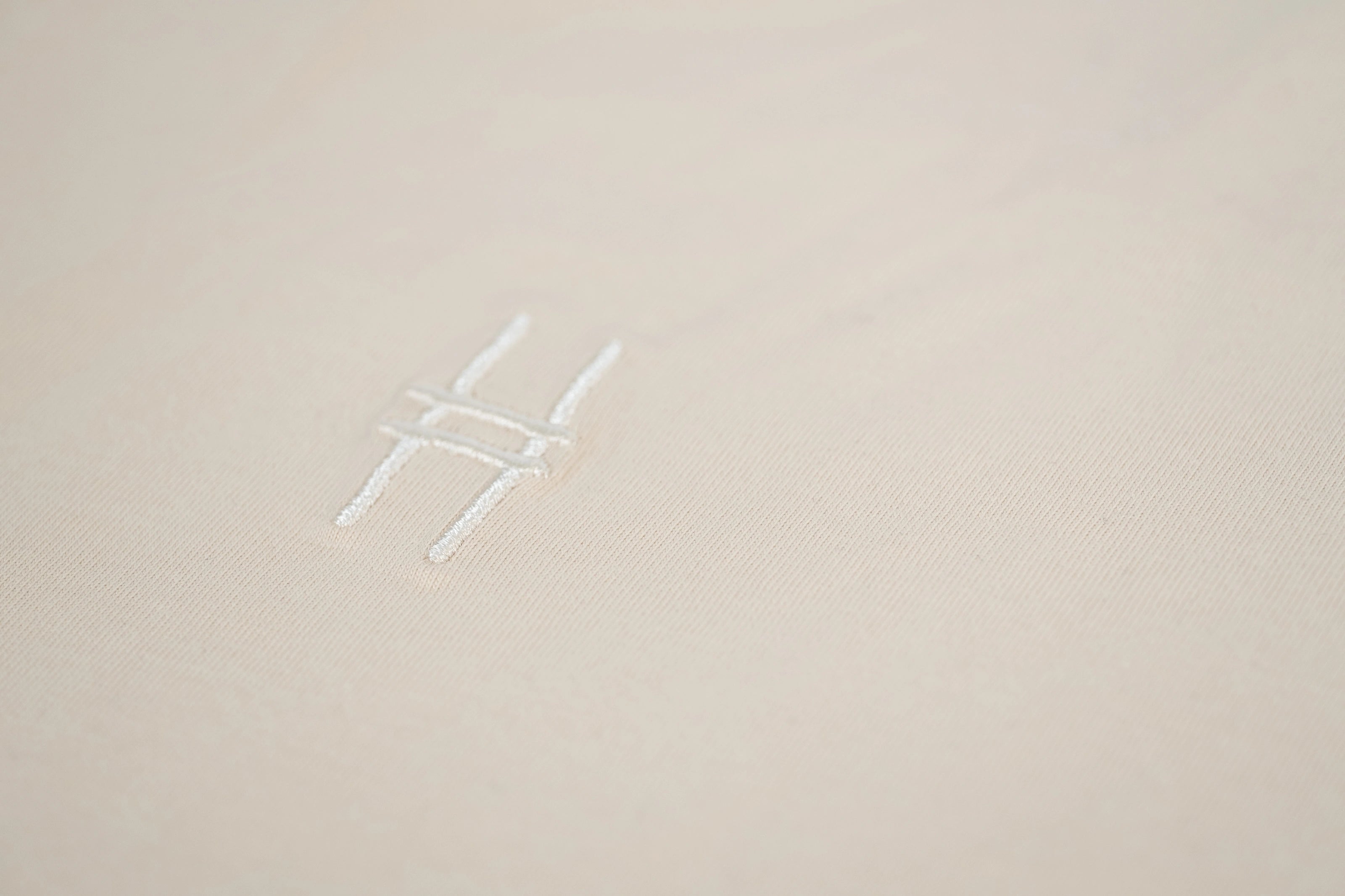 Closeup of High Line icon chest embroidery detail.