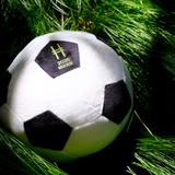High Line Soccer Plush against grasses dappled in sunlight.