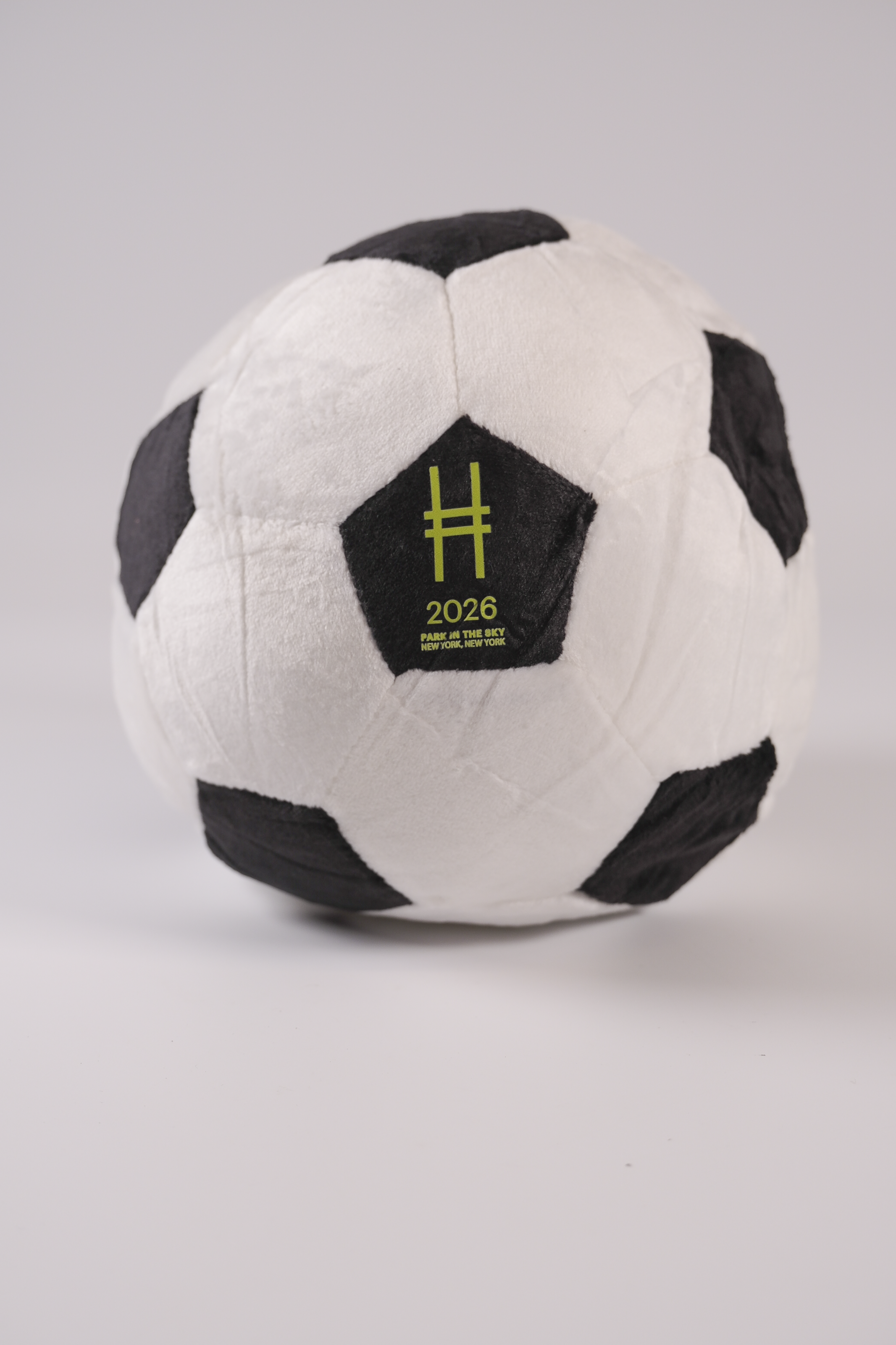 Plush soccer ball with High Line icon and "2026 Park in the Sky NY NY"on a gray background