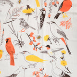 Claudia Pearson x High Line Washington Grassland tea towel in detail. The flour sack cotton tea towel is covered in illustrations of birds and plants that populate the High Line in browns, yellows and oranges.