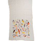 Claudia Pearson x High Line Washington Grassland tea towel, shown in full. The flour sack cotton tea towel is half covered in illustrations of birds and plants that populate the High Line in browns, yellows and oranges.