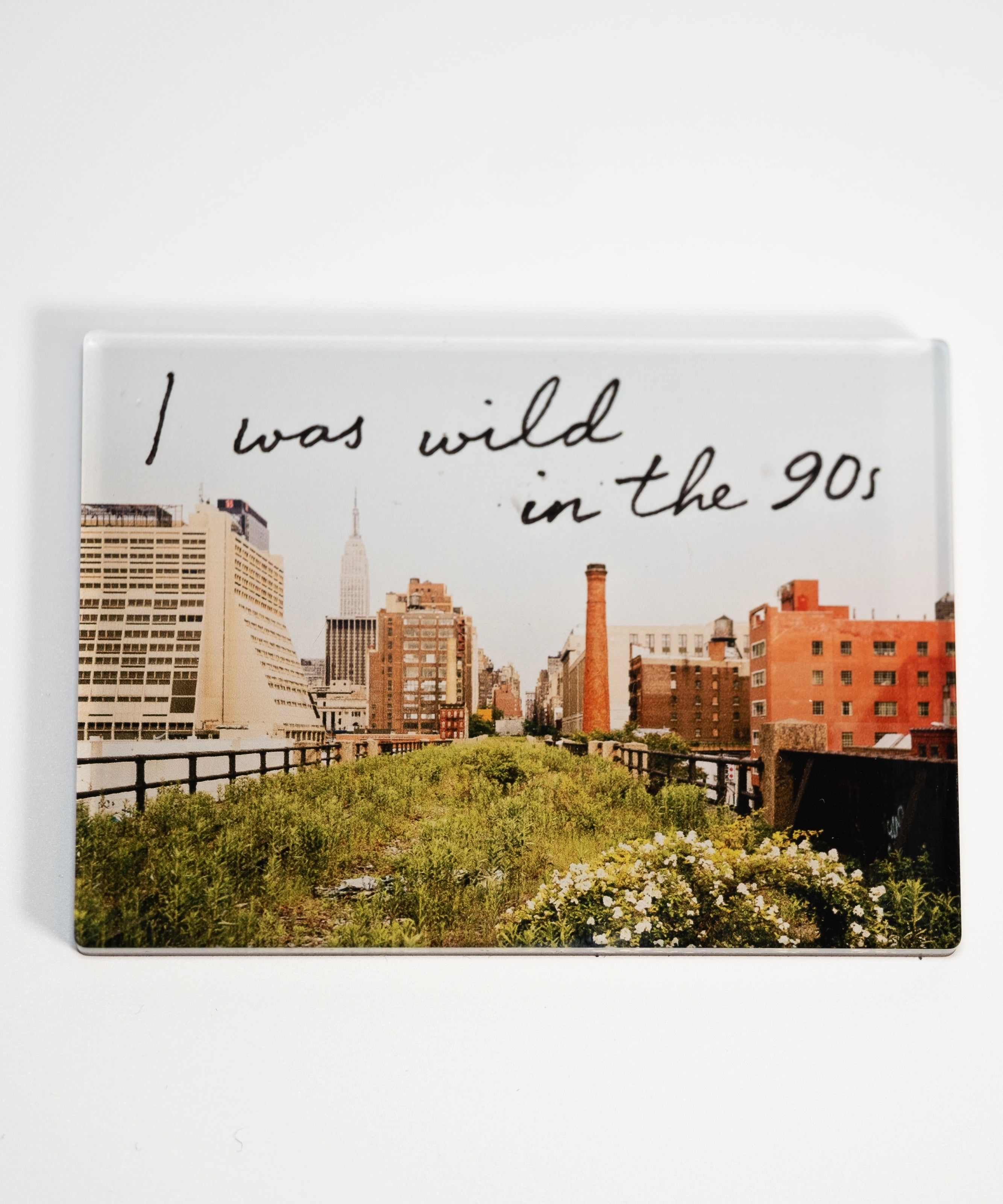 Wild in the 90s acrylic fridge magnet—featuring one of Joel Sternfeld's images from Walking the High Line and the phrase "I was wild in the 90s."