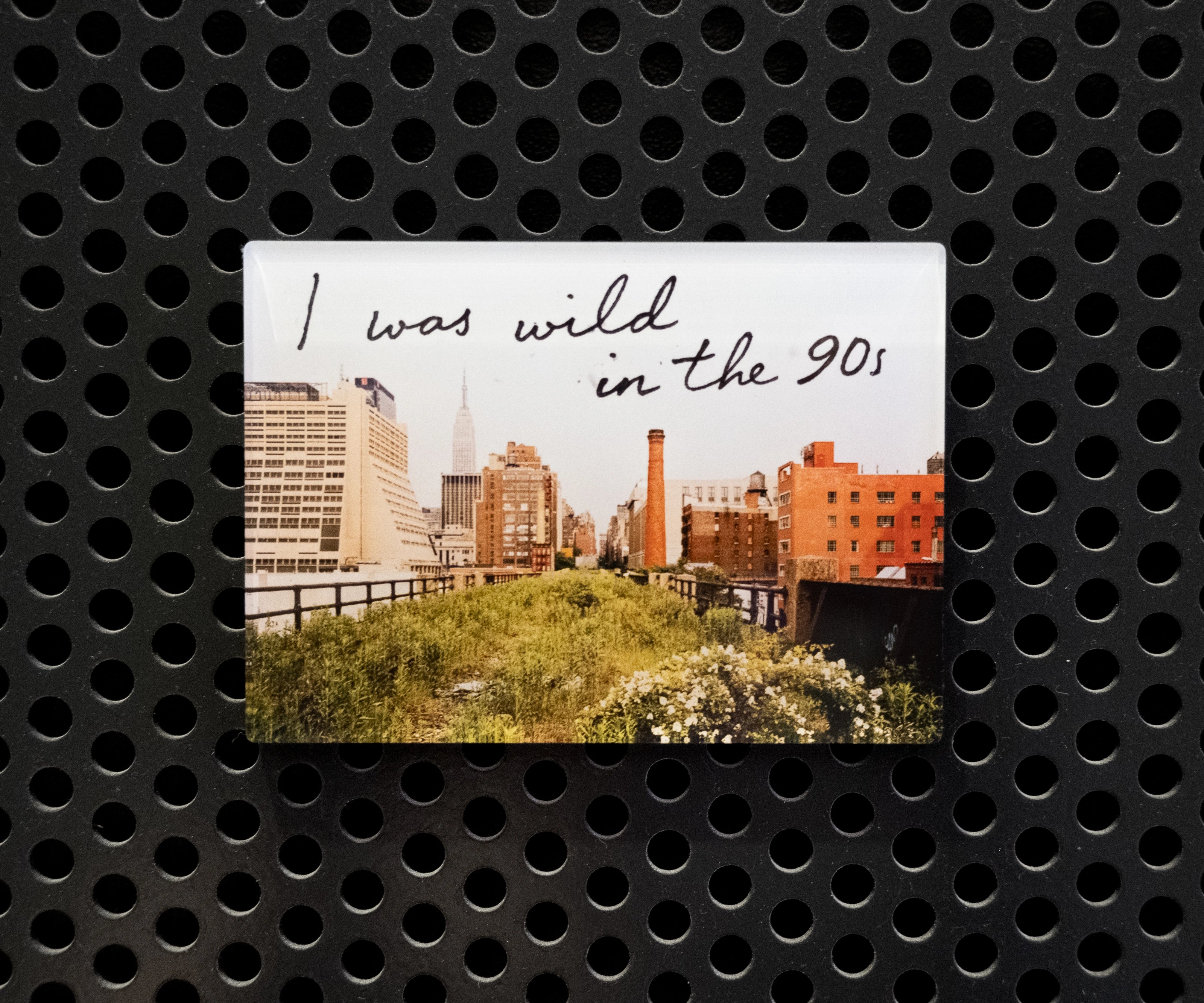 Wild in the 90s acrylic fridge magnet—featuring one of Joel Sternfeld's images from Walking the High Line and the phrase "I was wild in the 90s."