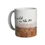 Wild in the 90s Mug, front. Full mug is wrapped in a Joel Sternfeld image of the High Line, with "I was wild in the 90s" written in the negative space.