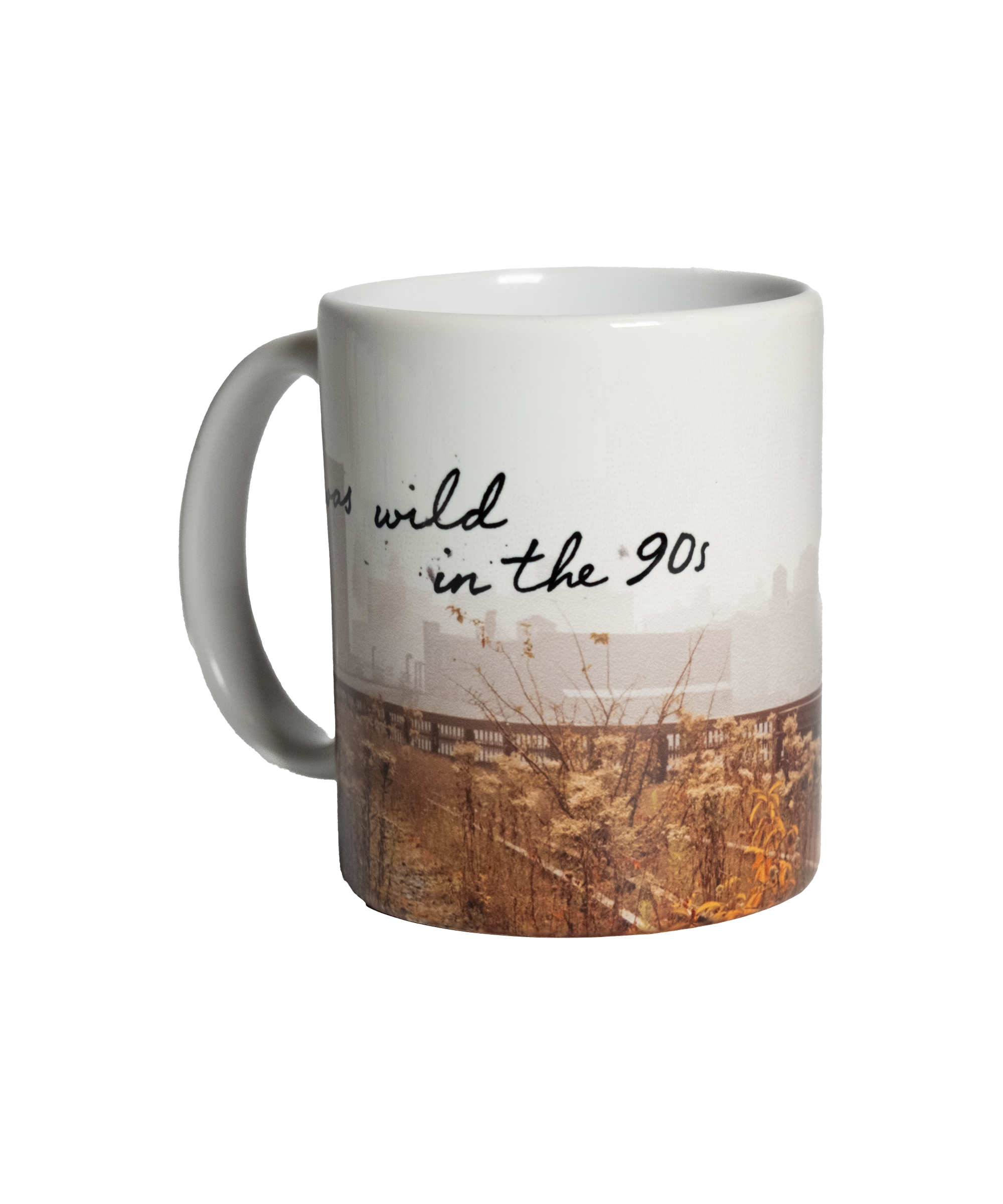 Wild in the 90s Mug, front. Full mug is wrapped in a Joel Sternfeld image of the High Line, with "I was wild in the 90s" written in the negative space.