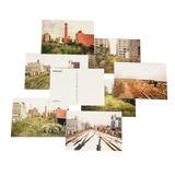 Joel Sternfeld Postcards scattered and overlapping.