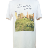 White T-shirt with one of Joel Sternfeld's iconic photos of the High Line with the phrase "I was wild in the 90s" in Sternfeld's handwriting.