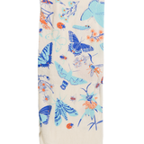 Claudia Pearson x High Line Wildflower Field tea towel, folded in sixths. The flour sack cotton tea towel is covered in illustrations of butterflies, ladybugs, moths, other insects and wildflowers in blues and oranges.